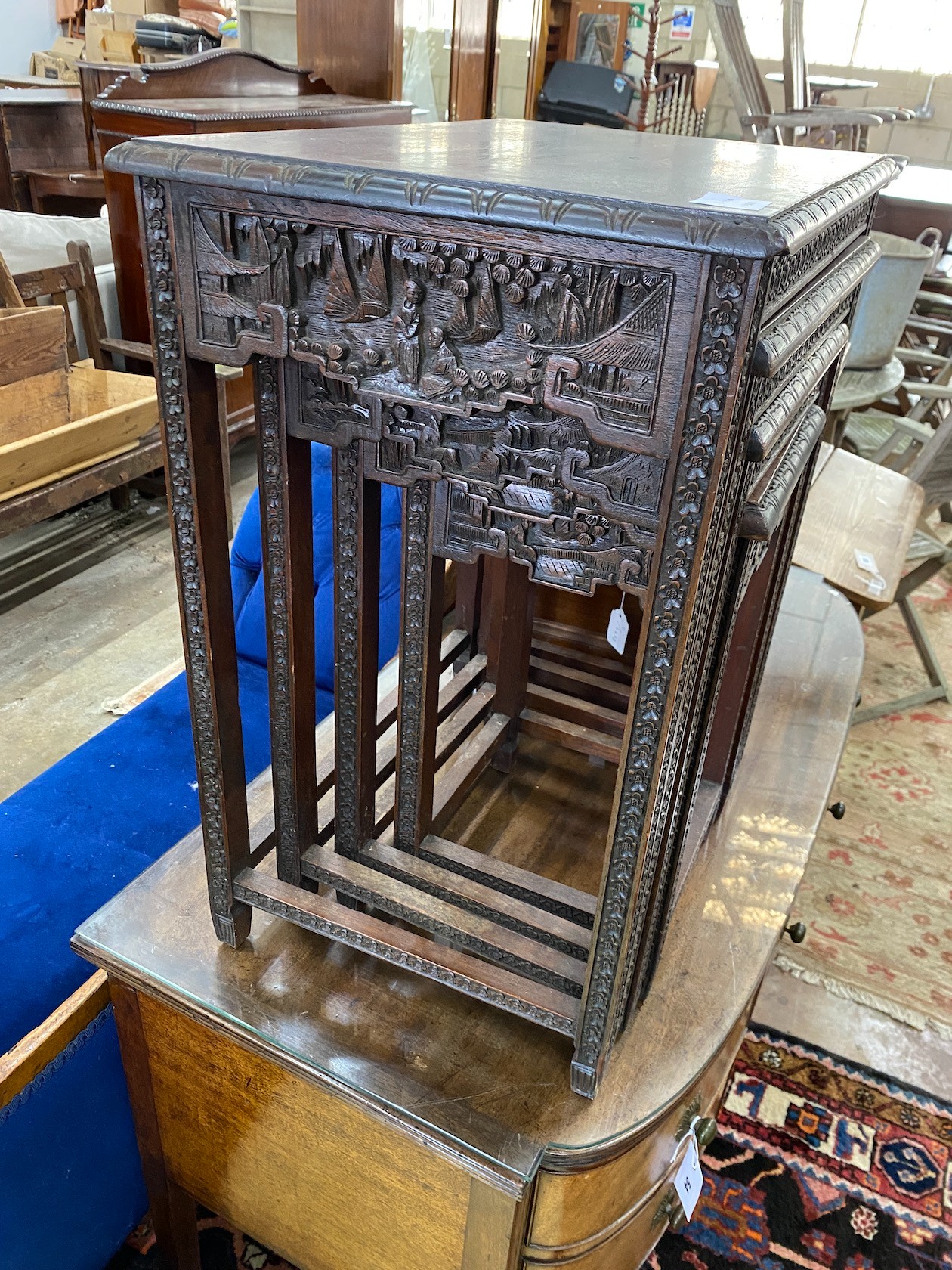 A quartetto of Malaysian rectangular carved hardwood tables, width 52cm, depth 38cm, height 64cm.